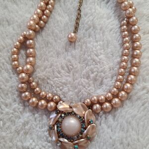 Elegant Pearl Necklace with Gold and Blue Accents